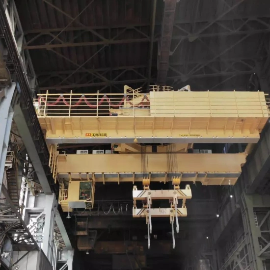 Rotating charging crane for manufacturing plants